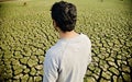 Man standing around a dried soil surface land