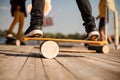 Man standing on the balance board on the wooden pier Royalty Free Stock Photo