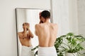 Man standing in bathroom in morning