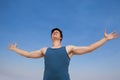 Man standing at beach with arms outstretched Royalty Free Stock Photo