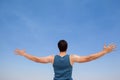 Man standing at beach with arms outstretched Royalty Free Stock Photo