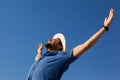 Man standing at beach with arms outstretched Royalty Free Stock Photo