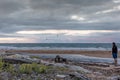 Man standing at a beach in Tasmania at sunset