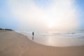 Man standing on beach watching the sunrise in pondicherry Royalty Free Stock Photo