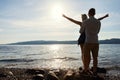 Man Standing Behind And Holding Girlfriend With Arms Outstretched Royalty Free Stock Photo