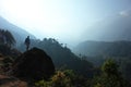 Man standing on big rock in Himalayas mountains Nepal Royalty Free Stock Photo