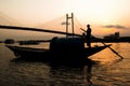 Man standing on a boat at the sunset Royalty Free Stock Photo