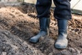 Man standing in boots on soil Royalty Free Stock Photo