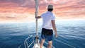 Man standing at the bow of a ship. Yachting, vacation and freedom concept Royalty Free Stock Photo