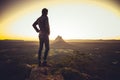 Man standing on cliff above valley Royalty Free Stock Photo