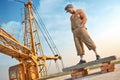 Man standing on concrete construction on high.