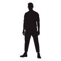 Man standing confidently facing forward with his legs crooked