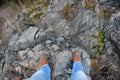 Man standing on edge of a cliff