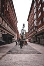 Man standing at an empty street in London