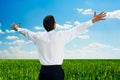 Man standing at the field at sunny day Royalty Free Stock Photo