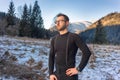 Man standing on mountain wearing First Layer