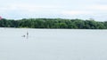 View of the man standing firmly on the SUP inflatable board Royalty Free Stock Photo