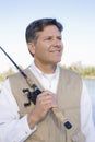 Man Standing With Fishing Pole Royalty Free Stock Photo