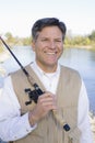 Man Standing With a Fishing Pole Royalty Free Stock Photo