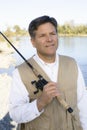 Man Standing With Fishing Pole Royalty Free Stock Photo