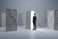 Man standing in front of abstract white puzzle door in interior. Future, choice, success, direction, opportunity and solution Royalty Free Stock Photo