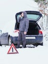 Man standing in front of damaged car and calling car services to Royalty Free Stock Photo