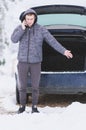 Man standing in front of damaged car and calling car services to Royalty Free Stock Photo