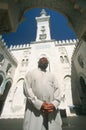 A man standing in front of an Islamic Study Center Royalty Free Stock Photo