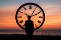 a man is standing in front of a large clock Royalty Free Stock Photo