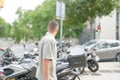 A man is standing in front of a row of parked motorcycles Royalty Free Stock Photo