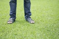 Man standing on green grass.