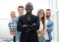 Man is standing with his arms crossed with his team Royalty Free Stock Photo