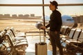 Man standing with his luggage at an airport. Royalty Free Stock Photo