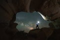 Man standing in a hole in the rock at Escalante Utah Royalty Free Stock Photo