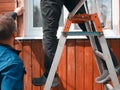 Man standing on ladder