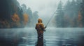 Man Standing in Lake Holding Fishing Pole Royalty Free Stock Photo