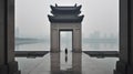 A man standing on a large chinese architecture gate misty fogy, lake and city at the background