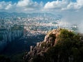 Man standing on the Lion rock above Hong Kong island under fog Royalty Free Stock Photo