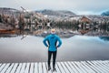 Man standing and looking at beautiful white winter nature