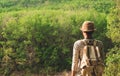 A man standing looking forest on mountains with backpack Travel Lifestyle wanderlust adventure concept summer vacations outdoor Royalty Free Stock Photo