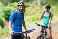 Man standing with mountain bike in forest Royalty Free Stock Photo