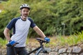 Man standing with mountain bike on the road Royalty Free Stock Photo