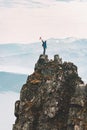 Man standing on mountain cliff summit travel adventure climbing outdoor Royalty Free Stock Photo