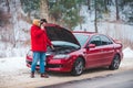 man standing near broken car with opened hood calling help Royalty Free Stock Photo