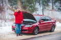 man standing near broken car with opened hood calling help Royalty Free Stock Photo