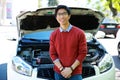 Man standing near car with bonnet open Royalty Free Stock Photo