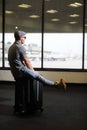 Funny man in airport with suitcase Royalty Free Stock Photo