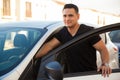 Man standing next to his car