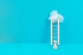 Man is standing next to a ladder, climbing up in career, having a goal, brainstorming for ideas, success strategy, challenge