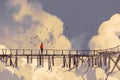 Man standing on old bridge in clouds